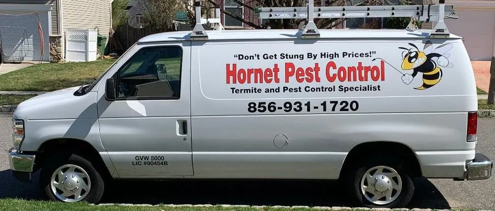 White van displaying "Honey Pest Control" branding.